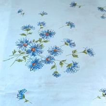 Load image into Gallery viewer, Dress your bed with this vintage twin size &#39;Miracle&#39; flat sheet featuring a lovely pattern of blue, orange and green flower pattern on baby blue. Cotton/Poly blend. Manufactured by Pacific, USA, circa 1970s. Create a restful slumber with this beautifully designed, high quality textile, or repurpose for crafting or sewing projects!  In excellent condition, free from stains/tears. Colours are vibrant.  Measures 72 x 104 inches
