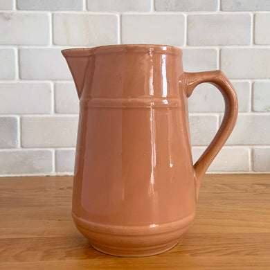 Vintage gloss mocha glazed ceramic tapered pitcher with horizontal bands. Crafted by Donvale Vitrified China, Canada, early 20th century. Restaurant ware nicely complements any farmhouse and cottage kitchen or use as a vase.

In as found vintage condition, glaze pops and chipping at the rim, no cracks/repairs. Unmarked.

Measures 5 3/4 x 6 1/8 inches including handle/spout, mouth 3 inches