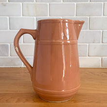 Load image into Gallery viewer, Vintage gloss mocha glazed ceramic tapered pitcher with horizontal bands. Crafted by Donvale Vitrified China, Canada, early 20th century. Restaurant ware nicely complements any farmhouse and cottage kitchen or use as a vase.

In as found vintage condition, glaze pops and chipping at the rim, no cracks/repairs. Unmarked.

Measures 5 3/4 x 6 1/8 inches including handle/spout, mouth 3 inches
