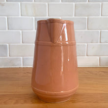 Load image into Gallery viewer, Vintage gloss mocha glazed ceramic tapered pitcher with horizontal bands. Crafted by Donvale Vitrified China, Canada, early 20th century. Restaurant ware nicely complements any farmhouse and cottage kitchen or use as a vase.

In as found vintage condition, glaze pops and chipping at the rim, no cracks/repairs. Unmarked.

Measures 5 3/4 x 6 1/8 inches including handle/spout, mouth 3 inches
