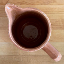 Load image into Gallery viewer, Vintage gloss mocha glazed ceramic tapered pitcher with horizontal bands. Crafted by Donvale Vitrified China, Canada, early 20th century. Restaurant ware nicely complements any farmhouse and cottage kitchen or use as a vase.

In as found vintage condition, glaze pops and chipping at the rim, no cracks/repairs. Unmarked.

Measures 5 3/4 x 6 1/8 inches including handle/spout, mouth 3 inches
