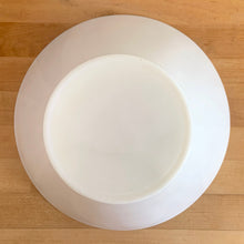 Load image into Gallery viewer, Elevate your table with this large vintage milk glass serving bowl, featuring a bold conical silhouette that embodies Modernist design. While Anchor Hocking produced a similar clear version, this piece's maker remains a mystery—adding to its vintage charm. Versatile and elegant, it's equally at home presenting a fresh salad, your favorite snacks, or as centerpiece filled with fruit. The perfect combination of nostalgia and contemporary style.

In excellent condition, no chips.

Measures 10 3/4 x 6 inches
