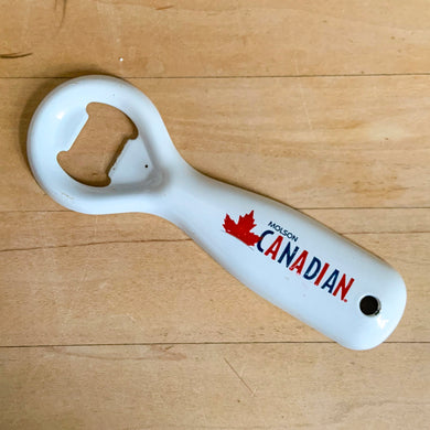 Vintage Molson Canadian classic promotional advertising white enamel coated metal bottle opener with drilled hole for hanging. Crafted by Ledco, Canada. A great addition to any beer drinker's barware collection!

In excellent condition.

Measures 5 1/4 inches