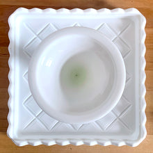 Load image into Gallery viewer, Underside of Indiana Glass Monterey milk glass square pedestal cake stand showing base and scalloped rim
