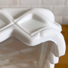 Load image into Gallery viewer, Corner detail of Indiana Glass Monterey milk glass square cake stand showing manufacturer's defect on diamond edge
