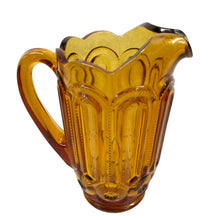 Load image into Gallery viewer, side view of LE Smith Moon and Star amber glass pitcher with ice lip, 40 oz vintage pattern glass
