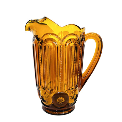 Vintage Moon and Star amber glass 40oz ice lip pitcher. Crafted by LE Smith Glass, USA. Perfect for serving your favourite beverage!

In excellent condition, no chips.

Measures 7 3/8 x 4 3/4 x 8 1/8 inches