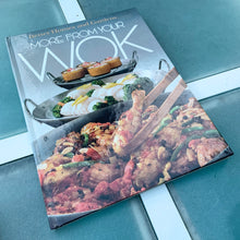 Load image into Gallery viewer, Better Homes and Gardens is known for its fabulous cookbooks. This hardcover cookbook focuses on More From Your Wok inspired recipes. Its 96 pages are filled with amazing  recipes along with many colour photographs. Originally published by Meredith Corporation, USA, 1982. Ninth printing 1990 shows that this was a very popular cookbook!  In excellent condition.
