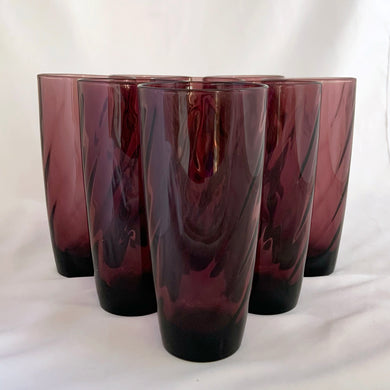 A fabulous set of 8 vintage Moroccan Amethyst Swirl flat iced tea glass. Crafted by Hazel-Atlas Glass, USA, 1940-1960s. Perfect as a wedding, bridal shower or housewarming gift.  These glasses feature an optic swirl pattern and are perfect for everyday or add them to your barware collection...cheers!

In excellent condition, no chips.

Measures 3 x 6 1/4 inches

Capacity 16 ounces
