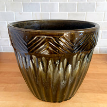 Load image into Gallery viewer, Vintage glossy moss green brown drip glaze ceramic jardiniere planter featuring ribbed body with chevron band at the rim. Crafted by Robinson Ransbottom Pottery Co., USA, 1960s. A beautiful piece to add to your art pottery collection!

In excellent condition, no chips/cracks/repairs. Maker&#39;s marks.

Measures 10 1/4 x 8 7/8 inches
