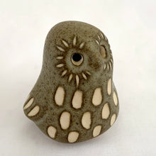 Load image into Gallery viewer, A sweet vintage handmade art pottery owl figurine glazed in moss green with white spots and brown details. Crafted by Strawberry Hill Werkshop, Canada, 1970s. This highly collectible piece is a must-have for any owl collector and is perfect for adding a touch of whimsy to your decor.

Excellent condition, no chips/cracks/repairs. Maker&#39;s mark.

Measures 2 3/8 x 2 x 2 1/2 inches
