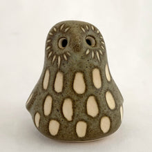 Load image into Gallery viewer, A sweet vintage handmade art pottery owl figurine glazed in moss green with white spots and brown details. Crafted by Strawberry Hill Werkshop, Canada, 1970s. This highly collectible piece is a must-have for any owl collector and is perfect for adding a touch of whimsy to your decor.

Excellent condition, no chips/cracks/repairs. Maker&#39;s mark.

Measures 2 3/8 x 2 x 2 1/2 inches
