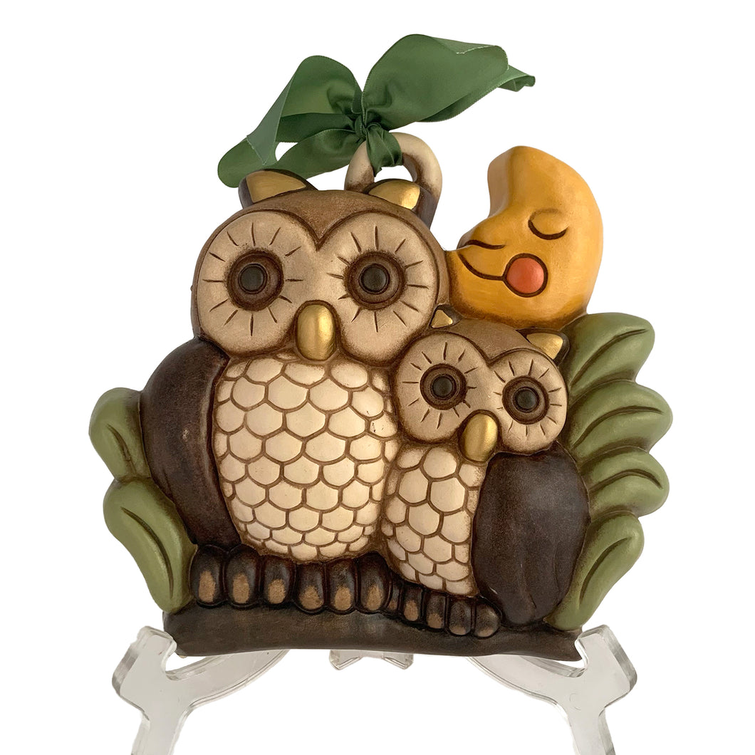 Vintage hand painted ceramic wall hanging featuring a mother and baby owl perched on a branch under a smiling moon in shades of brown, cream, green, yellow, orange and gold. Crafted by Thun, Italy, 1980s. Highly collectible and adorable wall decor for any room in your home!

In excellent condition, no chips/cracks/repairs. Embossed mark and original sticker.

Measures 8 5/8 x 7 3/4 x 2 1/8 inches