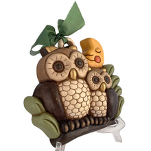 Load image into Gallery viewer, Vintage hand painted ceramic wall hanging featuring a mother and baby owl perched on a branch under a smiling moon in shades of brown, cream, green, yellow, orange and gold. Crafted by Thun, Italy, 1980s. Highly collectible and adorable wall decor for any room in your home!

In excellent condition, no chips/cracks/repairs. Embossed mark and original sticker.

Measures 8 5/8 x 7 3/4 x 2 1/8 inches
