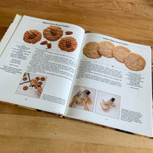 Load image into Gallery viewer, This fabulous vintage hardcover cookbook features decadent cookie, bar, brownies, cake, pie recipes and more straight from Mrs. Fields herself! Its 120 pages are filled with amazing recipes along with many colour photographs. All recipes developed and perfected by Debbi Fields. Published by Time Life Books, 1992.   In great condition!   
