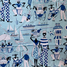 Load image into Gallery viewer, White cotton linen fabric with a hand printed vintage whimsical joyful Nassau island themed art featuring travel, life and leisure motifs in black, royal blue, baby blue and white. Designed by Beverly Wasile and crafted by Moygashel Linens in Ireland, known for its high quality textiles. Wasile was a mid-century artist known for Bahamian themed art. Perfect for dressmaking, or home decor. Excellent condition, free from stains/tears. Measures 36 x 144 inches

