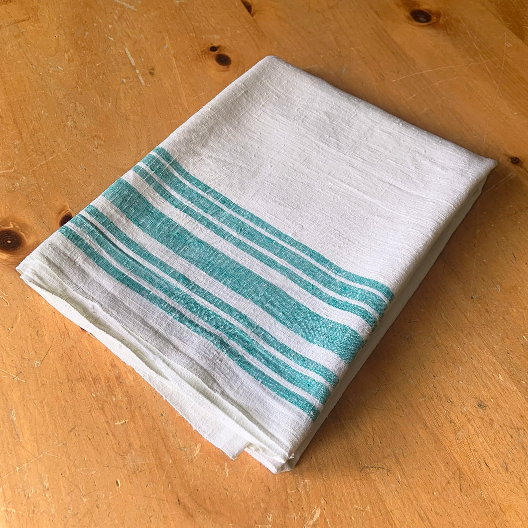 Vintage natural cotton linen tablecloth featuring wide and narrow turquoise stripes. Give your table a touch of rustic charm with this grain sack style table covering. Perfect for farmhouse, shabby chic and cottage core decor styles.  In excellent condition, free from stains/tears  Tablecloth measures 52 x 78 inches