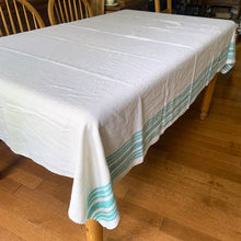 Load image into Gallery viewer, Vintage natural cotton linen tablecloth featuring wide and narrow turquoise green stripes. Give your table a touch of rustic charm with this grain sack style table covering. Perfect for farmhouse, shabby chic and cottage core decor styles.

In excellent condition, free from stains/tears

Tablecloth measures 52 x 78 inches
