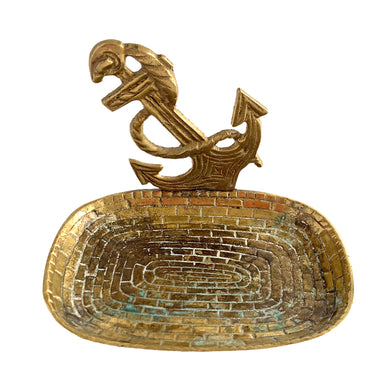 This unique vintage brass metal soap or trinket dish features a figural anchor and rope motif and the dish has a stacked brick pattern. It's a great piece to dress up a nautically themed bathroom or bedside table.  In excellent condition, with beautiful patina.  Measures 4 1/4 x 3 x 3 inches   