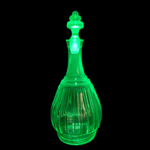 Load image into Gallery viewer, Vintage New Century Green Uranium Glass Decanter, Hazel-Atlas Glass, USA, 1930 - 1935. Glows brilliantly under black light. A wonderful addition to your glowy glass collection... perfect for a spooky barware display too!

In excellent condition, no chips to the decanter, chipping to the end of the stopper.

Measures 4 3/4 x 10 1/2 inches
