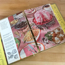 Load image into Gallery viewer, Better Homes and Gardens is known for its fabulous cookbooks and this special edition was produced to commemorate the sale of 10,000,000 BHG cookbooks. Four hundred pages, filled with a variety of inspired recipes, helpful tips and colour photographs are housed in this gold hard cover binder. Published by Meredith Corporation, USA, 1965, sixth printing. Perfect for the budding chef!  In great vintage condition with normal age-related page yellowing. 
