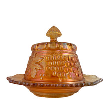 Load image into Gallery viewer, Opposite side profile of Northwood Grape &amp; Cable marigold carnival glass covered butter dish, showing lid finial and sawtooth rim of base dish, c. 1910
