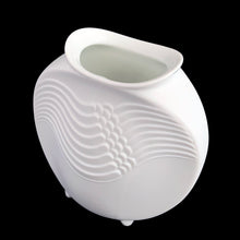 Load image into Gallery viewer, A delicate and elegant art nouveau style white bisque flower vase featuring embossed ocean wave design and glazed on the inside. Impressed &quot;M. Frey&quot; signature and shape number &quot;678&quot;. Crafted by Kaiser, Germany. A lovely vase to fill with a sweet bouquet of fresh or dried flowers In excellent condition, free from chips/cracks/repairs. Measures 4 x 4 inches
