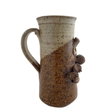 Load image into Gallery viewer, Vintage ochre cream glazed art pottery face mug featuring a mustached gentleman. Crafted by Andrew Van Der Putten Pottery, Canada, 1970s. A whimsical mug to add to your collection.

In excellent condition, no chips or cracks.

Measures 5 x 3 1/4 x 7 inches

Capacity 20 ounces
