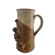 Load image into Gallery viewer, Vintage ochre cream glazed art pottery face mug featuring a mustached gentleman. Crafted by Andrew Van Der Putten Pottery, Canada, 1970s. A whimsical mug to add to your collection.

In excellent condition, no chips or cracks.

Measures 5 x 3 1/4 x 7 inches

Capacity 20 ounces
