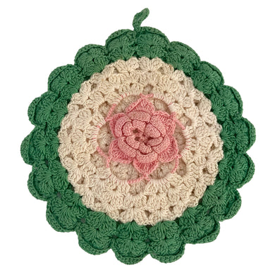 Vintage hand crocheted off-white round potholder inset with a pink three dimensional flower and green scalloped border and loop hanger. Perfect for a farmhouse or cottage style kitchen.


In excellent vintage condition, no tears or stains.

Measures 6 1/4 inches