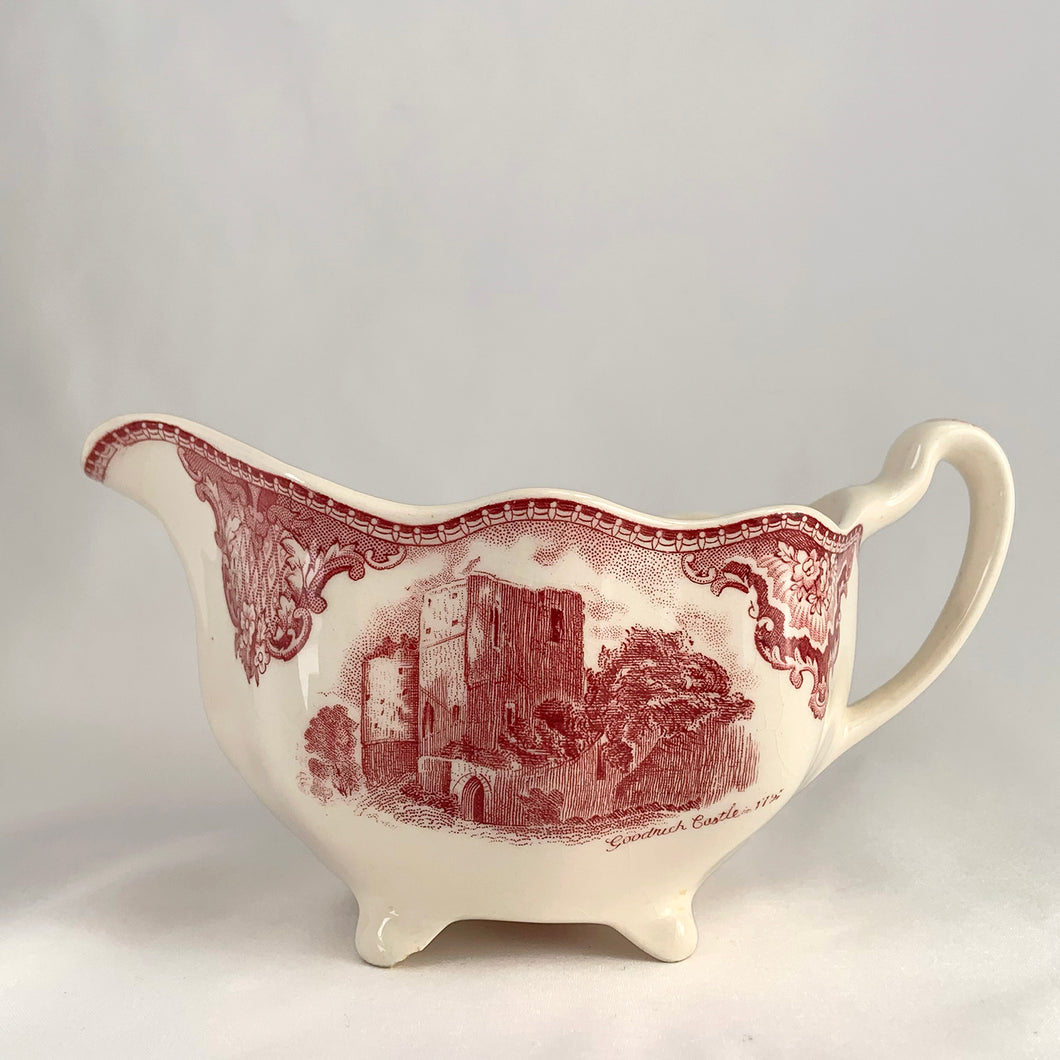 Vintage pink transferware Old Britain Castles creamer. Crafted by Johnson Bros, England, 1930 - 2003. A lovely way to enhance your tea and coffee experience!

In as found condition, inner chip to one of the feet, no cracks or repairs. Maker's mark on the bottom.

Measures 6 1/4 x 3 5/8 x 2 7/8 inches (incl. handle)

Capacity 8 ounces