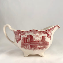 Load image into Gallery viewer, Vintage pink transferware Old Britain Castles creamer. Crafted by Johnson Bros, England, 1930 - 2003. A lovely way to enhance your tea and coffee experience!

In as found condition, inner chip to one of the feet, no cracks or repairs. Maker&#39;s mark on the bottom.

Measures 6 1/4 x 3 5/8 x 2 7/8 inches (incl. handle)

Capacity 8 ounces
