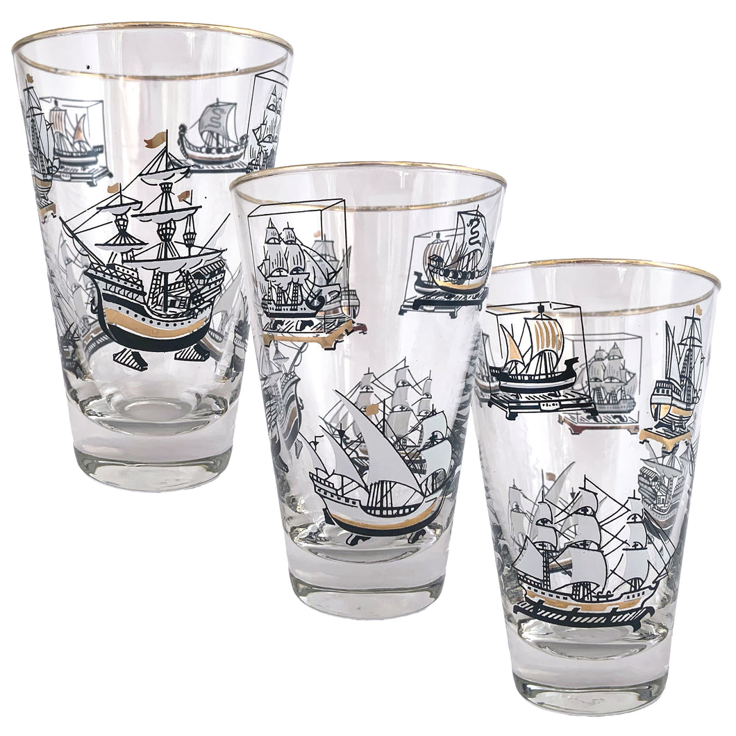 Set of six vintage Old Ships glass tumblers featuring black, white and gold sailing vessels with gold rims. Crafted by Libbey Glass, circa 1950s. A great addition to your barware collection or perfect for the sailing enthusiast!  In excellent condition, no chips, minor wear to the gold rim. Marked on the bottom with the Libbey 