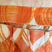 Load image into Gallery viewer, Transform any room into a vintage paradise with these vibrant pinch pleat fabric curtain panels! The bold yellow and orange hues and wavy geometric pattern will add a touch of mid-century modern flair and bring warmth and character to your space. With the soft, smooth fabric, you can enjoy a classic and cozy atmosphere. impeccable craftsmanship  In excellent condition, free from stains/tears measures 24 1/2 inches wide at the top, 43 1/2 inches wide at the bottom, 84 inches in length with a 5 inch hem.

