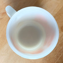 Load image into Gallery viewer, Overhead view of vintage Fire-King milk glass mug showing white glass  interior and rim, 8 oz capacity
