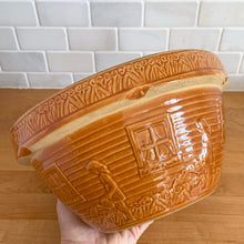 Load image into Gallery viewer, Rare find! Vintage orange girl with watering can yellow ware mixing bowl with charming homestead scene, No. 166-10. Crafted by Robinson Ransbottom, USA,&nbsp;1920s. A well-crafted piece of stoneware offering a nostalgic vibe to your farmhouse or cottage kitchenware and decor!

In excellent condition, no chips/cracks/repairs, age-related crazing. Maker&#39;s mark.

Measures 10 3/8 x 5 1/4 inches
