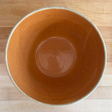 Load image into Gallery viewer, Rare find! Vintage orange girl with watering can yellow ware mixing bowl with charming homestead scene, No. 166-10. Crafted by Robinson Ransbottom, USA,&nbsp;1920s. A well-crafted piece of stoneware offering a nostalgic vibe to your farmhouse or cottage kitchenware and decor!

In excellent condition, no chips/cracks/repairs, age-related crazing. Maker&#39;s mark.

Measures 10 3/8 x 5 1/4 inches
