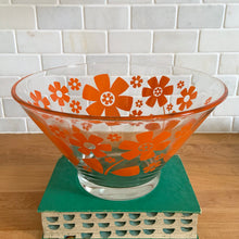 Load image into Gallery viewer, This vintage mid-century era large clear glass chip or salad bowl features graphic orange flowers. Crafted by Anchor Hocking, USA, 1960s. Fill this set with your favourite snacks or salads. The perfect serving piece to brighten up your next party, movie night, game night or get-together. Makes a wonderful housewarming, bridal shower, or birthday gift!

The glass is in excellent overall condition, no chips, minor wear.

Measures 10 3/4 x 5 7/8 inches

