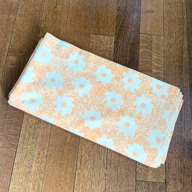 Dress your bed in this retro orange and white floral patterned poly/cotton blend twin size sheet. Manufactured by Brentford Nylons, England, circa 1970s. Create a restful slumber with these beautifully designed and well-made linens!  In excellent condition, free from stains/tears. Measures 70 x 104 inches