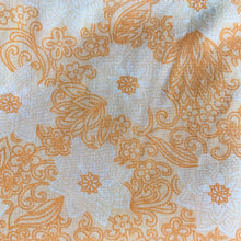 Load image into Gallery viewer, Dress your bed in this retro orange and white floral patterned poly/cotton blend twin size sheet. Manufactured by Brentford Nylons, England, circa 1970s. Create a restful slumber with these beautifully designed and well-made linens!  In excellent condition, free from stains/tears. Measures 70 x 104 inches
