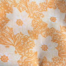 Load image into Gallery viewer, Dress your bed in this retro orange and white floral patterned poly/cotton blend twin size sheet. Manufactured by Brentford Nylons, England, circa 1970s. Create a restful slumber with these beautifully designed and well-made linens!  In excellent condition, free from stains/tears. Measures 70 x 104 inches
