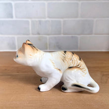 Load image into Gallery viewer, Delightful vintage orange tabby cat porcelain figurine Giftcraft, Japan. Add this sweet figurine to your collection!

In excellent condition, no chips/cracks. Sticker present.

Measures 3 7/8 x 1 1/2 x 2 1/4 inches
