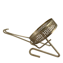 Load image into Gallery viewer, Close-up of the vintage Anchor Hocking chip and dip metal bracket showing ornate filigree ring cradle, wire frame construction, and hook detail, silver-tone finish, 1950s USA
