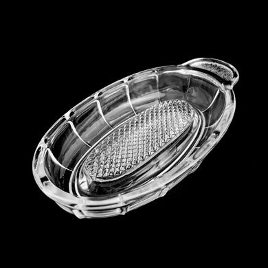 Vintage pressed glass food grater. Produced by Rhuglas, Germany, circa 1950s. Glass graters are used to puree fruit and grate garlic, ginger and hard cheeses to a perfect consistency. Glass graters were an essential part of a home cooks kitchen and essential for making baby food from scratch. Thanks to the non-porous nature of glass, it's very easy to keep clean, preventing absorption of odours or residue from previous use.   In excellent condition, free from chips.  Measures 7 1/3 x 3 1/8 x 1 1/8 inches