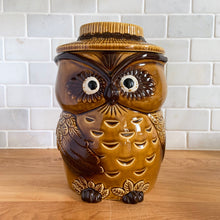Load image into Gallery viewer, This vintage cookie jar of sweet figural owl features well defined feathered wings and it&#39;s steely gaze really captures your attention. The owl&#39;s straw hat forms the lid. Crafted by Noritake, Japan for Giftcraft export. This piece is so stink&#39;n CUTE we couldn&#39;t wait to share it with our customers!   In outstanding condition, free from chips/cracks/wear. We believe this is new old stock. Bottom has the stamped maker&#39;s mark.  Measures 5 1/2 x 4 3/4 x 8 7/8 inches
