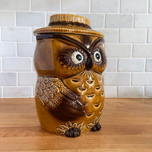 Load image into Gallery viewer, This vintage cookie jar of sweet figural owl features well defined feathered wings and it&#39;s steely gaze really captures your attention. The owl&#39;s straw hat forms the lid. Crafted by Noritake, Japan for Giftcraft export. This piece is so stink&#39;n CUTE we couldn&#39;t wait to share it with our customers!   In outstanding condition, free from chips/cracks/wear. We believe this is new old stock. Bottom has the stamped maker&#39;s mark.  Measures 5 1/2 x 4 3/4 x 8 7/8 inches

