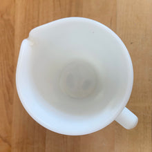 Load image into Gallery viewer, Vintage PYREX white opal milk glass handled creamer. Crafted by Corning, USA. The charming sidekick to your morning coffee or tea!

In excellent condition, no chips/cracks.

Measures 3 3/8 x 3 5/8 inches
