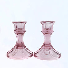 Load image into Gallery viewer, A very pretty pair of pink single light candle holders. Crafted by American Stemware, USA,  circa 1980s. Add these boho beauties to your decor for a nice pop of colour.  In excellent condition, no chips or cracks.  Measures 3 1/4 x 4 1/2 inches  Note: does not include candles.  

