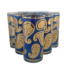 Load image into Gallery viewer, Vintage mid-century era set of eight royal blue and 22kt gold Paisley glass cocktail tumblers in brass caddy with teak handle. Crafted by Culver, USA, 1970s. Highly sought after by collectors, these gorgeous tumblers will make an excellent addition to your barware collection!

In great vintage condition, no chips, minor wear.

Tumblers measure inches 2 3/4 x 5 1/2 inches

Caddy measures 12 ounces
