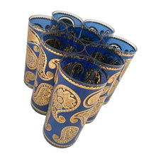 Load image into Gallery viewer, Vintage mid-century era set of eight royal blue and 22kt gold Paisley glass cocktail tumblers in brass caddy with teak handle. Crafted by Culver, USA, 1970s. Highly sought after by collectors, these gorgeous tumblers will make an excellent addition to your barware collection!

In great vintage condition, no chips, minor wear.

Tumblers measure inches 2 3/4 x 5 1/2 inches

Caddy measures 12 ounces
